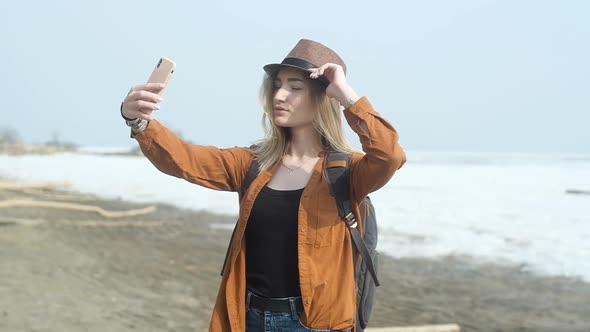 Active weekend in nature. woman uses a smartphone to take selfies in nature on.