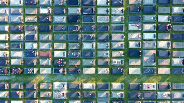 Tombs in a large cemetery with grid layout - aerial top down view