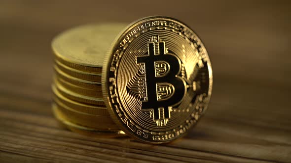 Bitcoins Are Stacked on Top of Each Other on the Table. Close Up