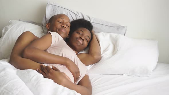 Young African American Couple Has a Calm, Serene Sleep.