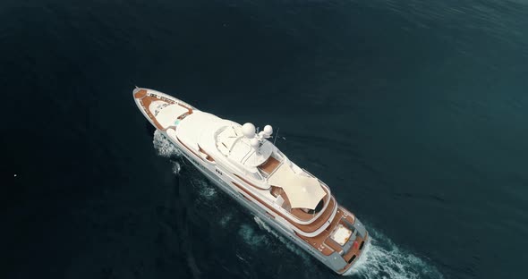 Large superyacht cruising underway in open ocean