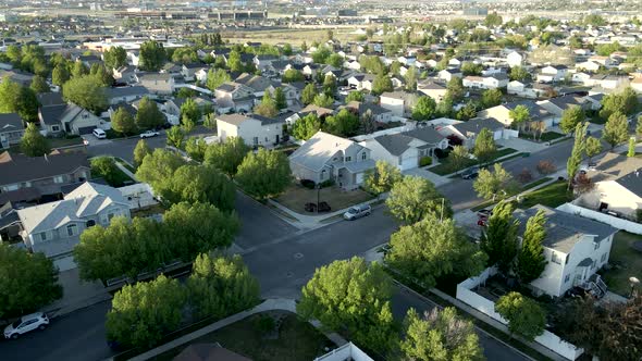 Single family homes in a suburban neighborhood then aerial tilt up to reveal a view of the Rocky Mou