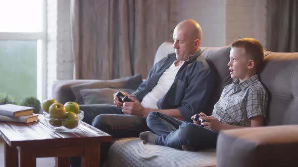 Father and Son Playing Video Game