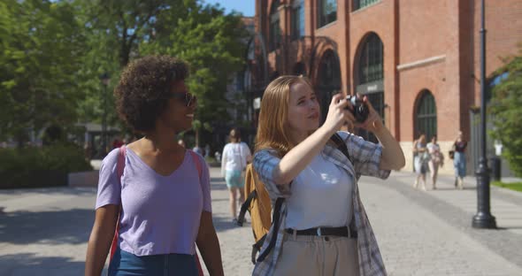 Diverse Young Women Tourists Walking Together in Summer City