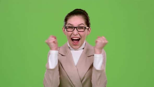 Girl Rejoices in Victory. Green Screen. Slow Motion