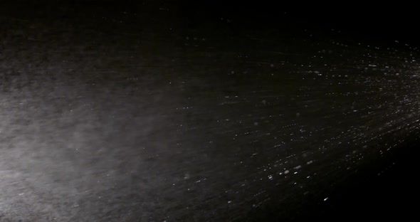 The Effect of Spraying Water on a Black Background Is Suitable To Replace in Your Video