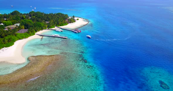 Wide flying abstract view of a white paradise beach and turquoise sea background in colorful 4K