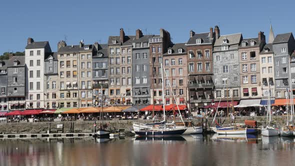 HONFLEUR, FRANCE - SEPTEMBER 2016 Slow pan on The Vieux Bassin port  by the day with colorful facade
