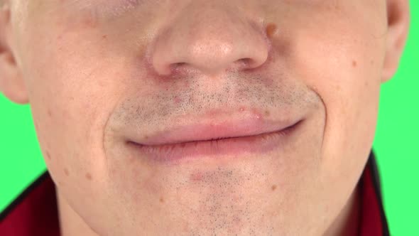 Young Man Smiling. Close Up of a Mouth