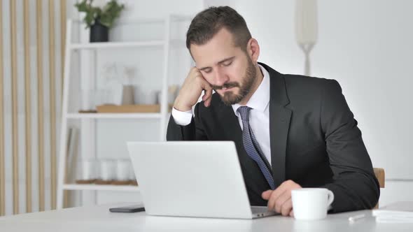 Tired Businessman Sleeping at Work