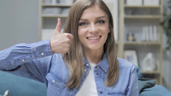 Thumbs Up By Young Girl in Creative Office