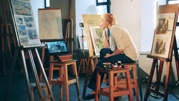 A Lady Is Studying Painting Online in the Art Studio