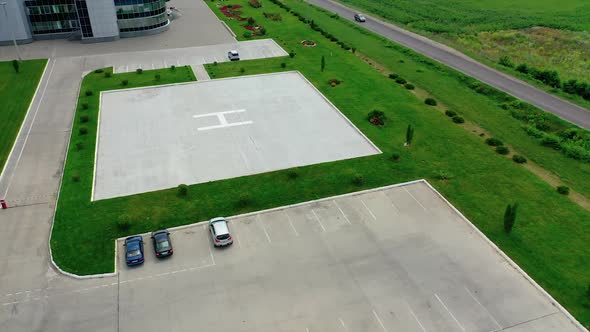 Helicopter landing site. Aerial view of a large modern industrial factory.