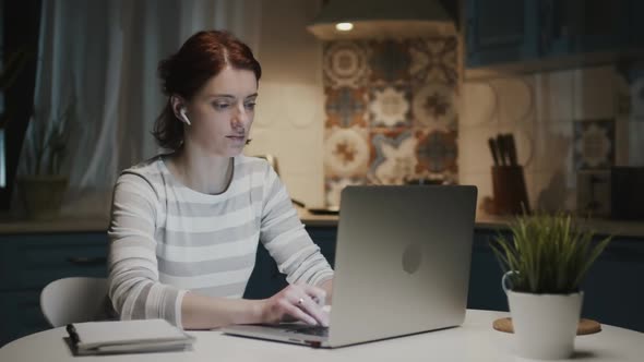 Woman In The Kitchen With Laptop