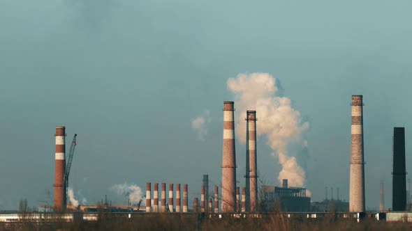 A lot of chimneys. Air pollution. Smoke destroys ozone.