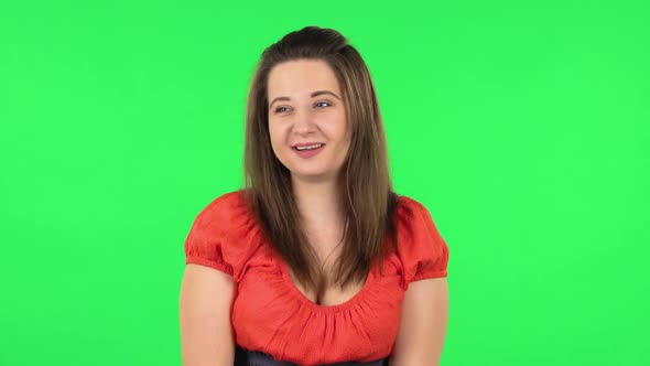 Portrait of Confused Girl Saying Oops and Shruging. Green Screen