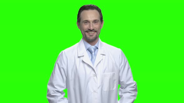 Pleasant Physician Standing in Medical Clothing