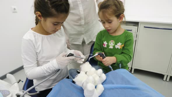 Girls playing the dentist