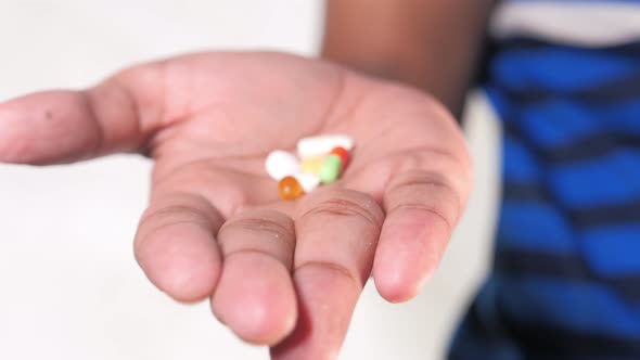 Close Up of Man Hand Holding Pills and Capsule with Copy Space