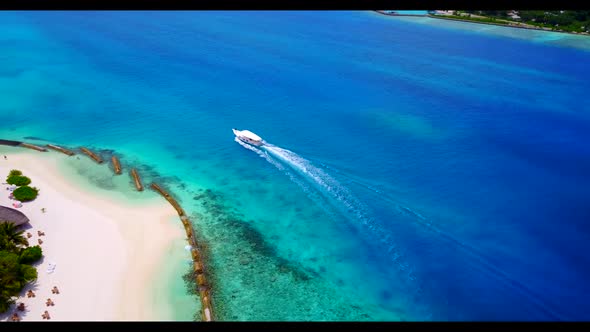 Aerial top down seascape of luxury shore beach journey by clear lagoon with white sand background of