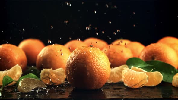 Drops of Water Fall on Ripe Tangerines