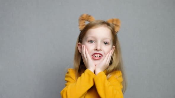 Cute Smiling Blond Girl with Tiger Ears