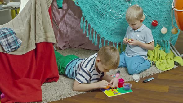 Brothers Forming Play Dough at Home