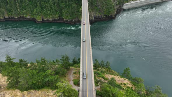 Top down aerial shot of cars commuting across the Pacific Ocean in Washington State.