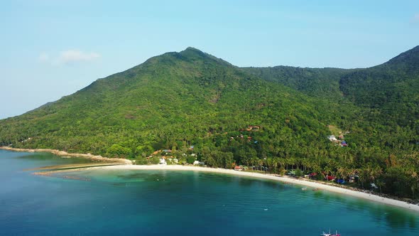 Beautiful above travel shot of a white sand paradise beach and aqua blue ocean background in hi res 