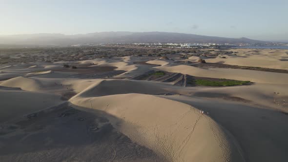 Majestic landscape of Maspalomas golden sand dunes, Gran Canaria. Calm sea waters