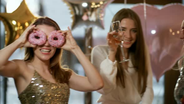 Dancing Girls Posing with Doughnut Eyes