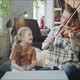 A Woman Shows a Child How to Play the Violin Correctly - VideoHive Item for Sale