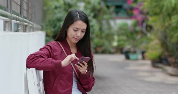 Young woman look at mobile phone