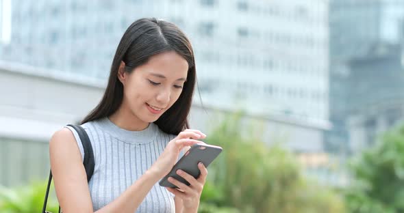 Woman using smart phone at outdoor