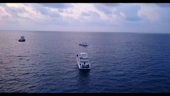 Aerial landscape of tranquil resort beach voyage by transparent ocean and white sandy background of 