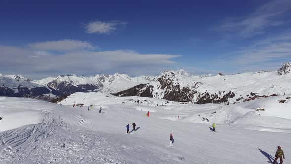 Aerial view of people skiing and snowboarding