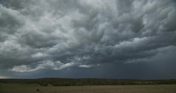Dark Ominous Grey Storm Clouds. Dramatic Sky. Lighting In Dark Stormy Clouds