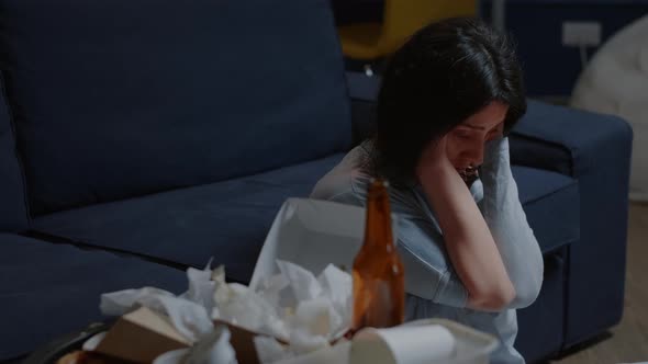 Desperate Woman Sitting Alone on Floor Swaying Having Suicide Thoughts