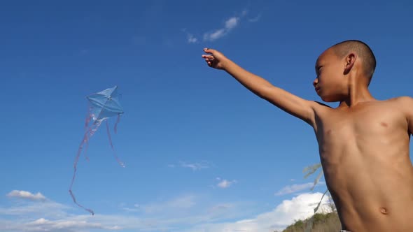 Poor Asian Boy Playing With Kite