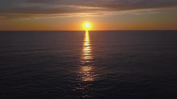 Aerial View Drone Flying Over Sea Surface in Evening Sun Light, Golden Hour Sunset, Cinematic Shot