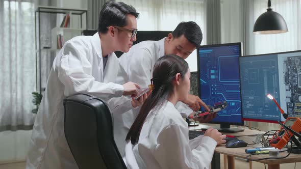 Asian Team Of Multi Engineers, Scientists Work On Tablet And Computer, Talk, Design Pcb