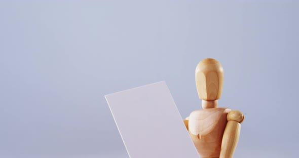 Figurine holding blank placard