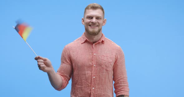 Young Man Waving German Flag