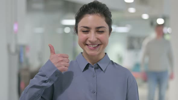 Portrait of Young Indian Woman Showing Thumbs Up Sign