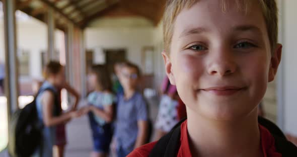 Boy smiling in the school corridor