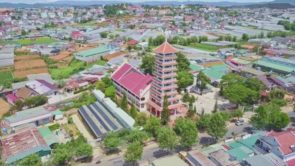 Aerial City View with Modern Catholic Church Bell Tower