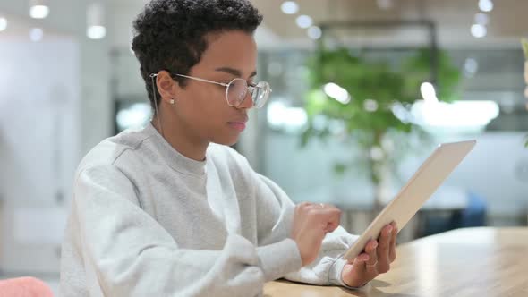 Casual African Woman Using Digital Tablet