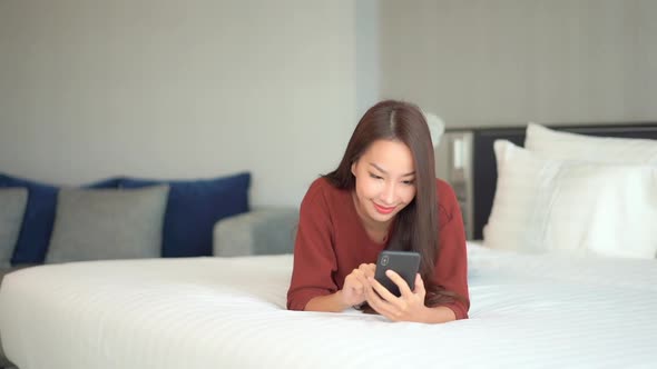 Young asian woman use smart phone