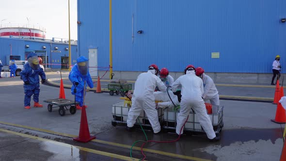 Security personnel practicing chemical emergency