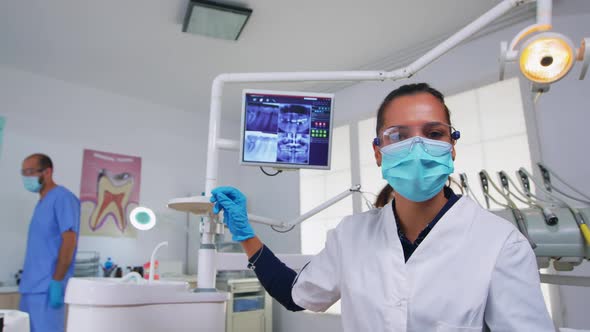 Doctor Measuring Woman Temperature Before Dental Examination